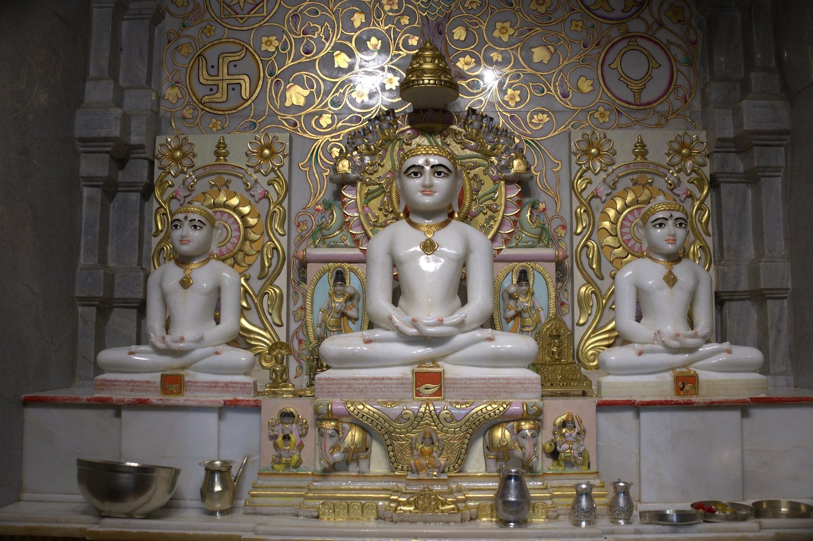 Serene Tirthankara idols in a meditative space